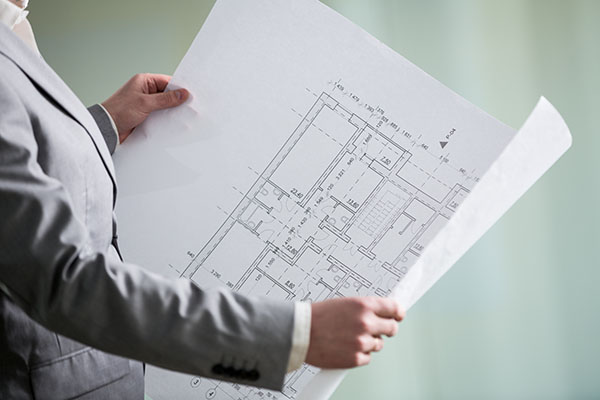 architectural plan in the hands of an architect